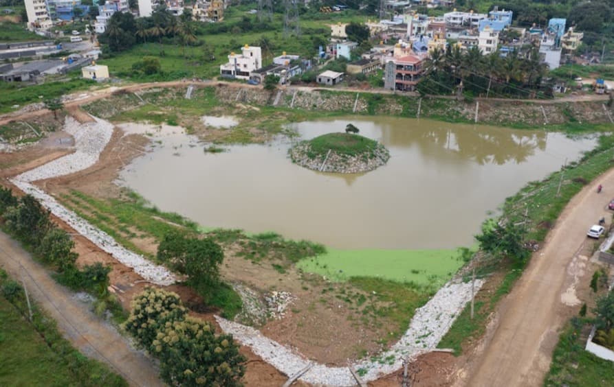 Mailsandra lake after rejuvenation with restored water area and stone-lined banks